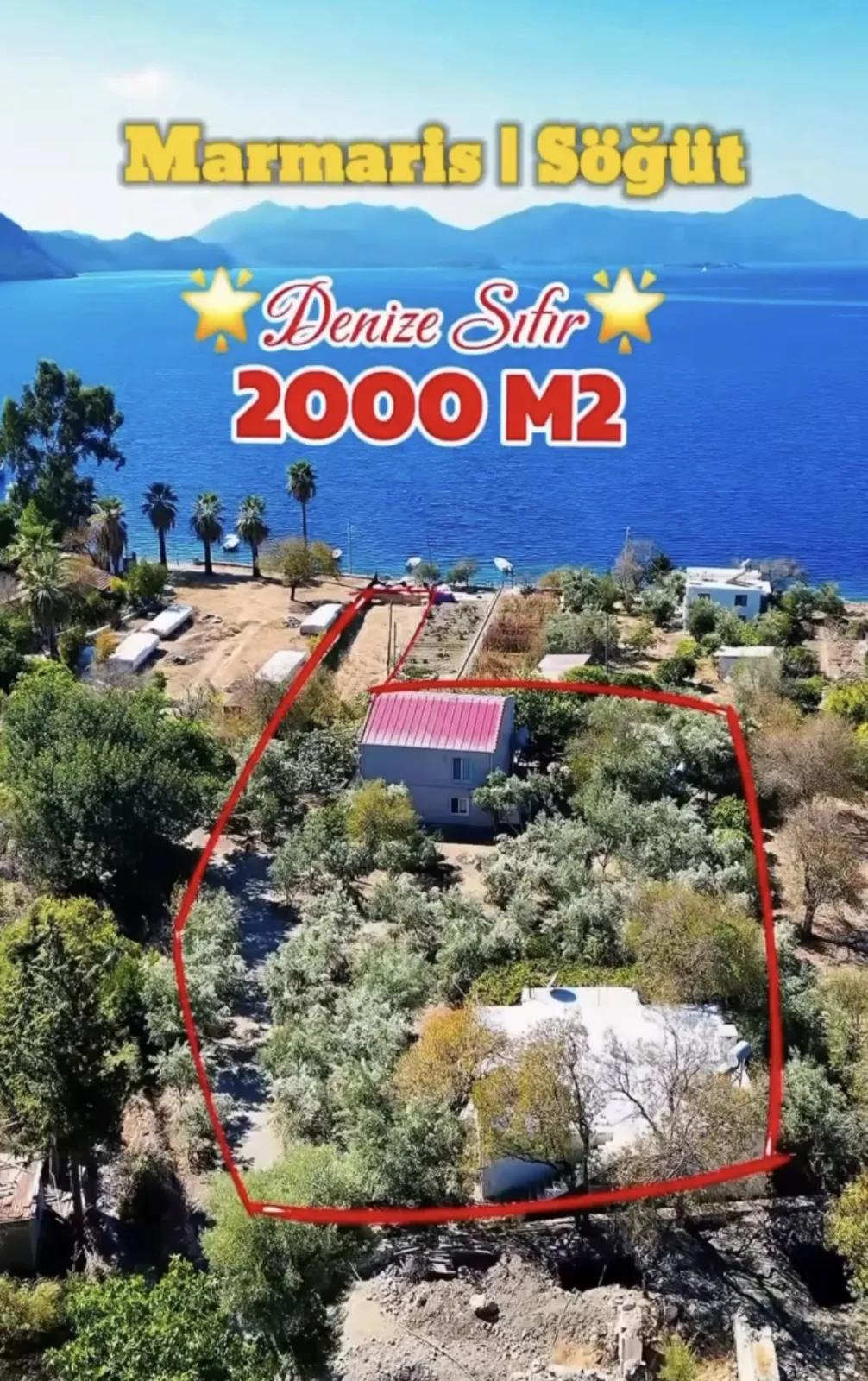 Marmaris Söğüt köyünde denize sıfır 2000 m2 yalı dairesi