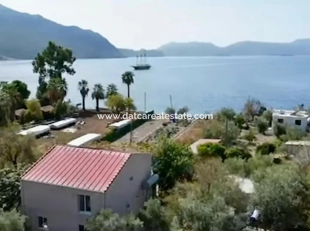 Marmaris Söğüt Mahallesi Denize Sıfır 2000M2 Arsa Satılık Müstakil Ev.önüne Tekne Bağlamaya Uygun.