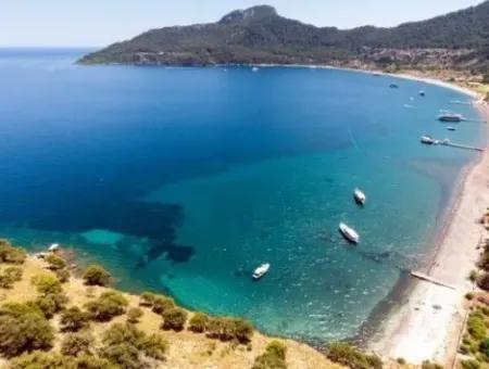 Marmaris,Den 18 Km Uzaklıkta 19000M2 Denize Sıfır Otel Arsamız Satılıktır.